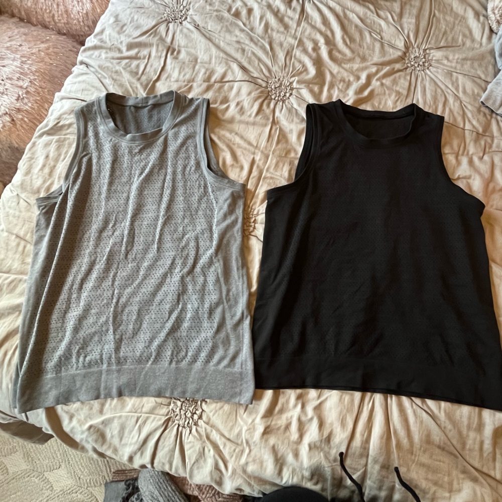 Lululemon breeze by muscle squad tank tops. Both size 6 one black and one grey.